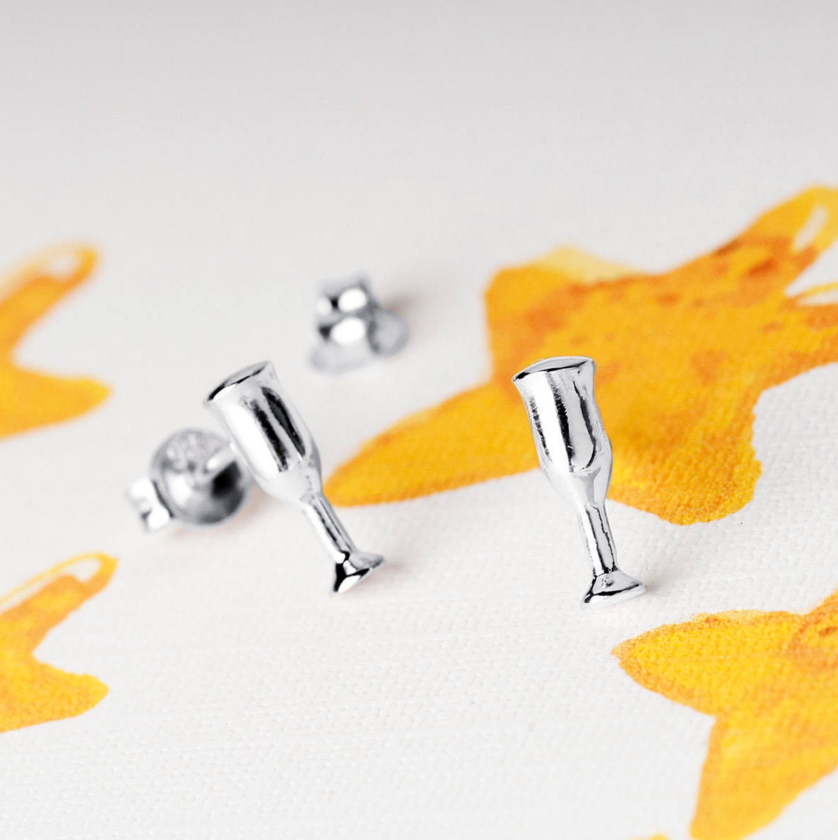 close up of sterling silver champagne glass stud earrings