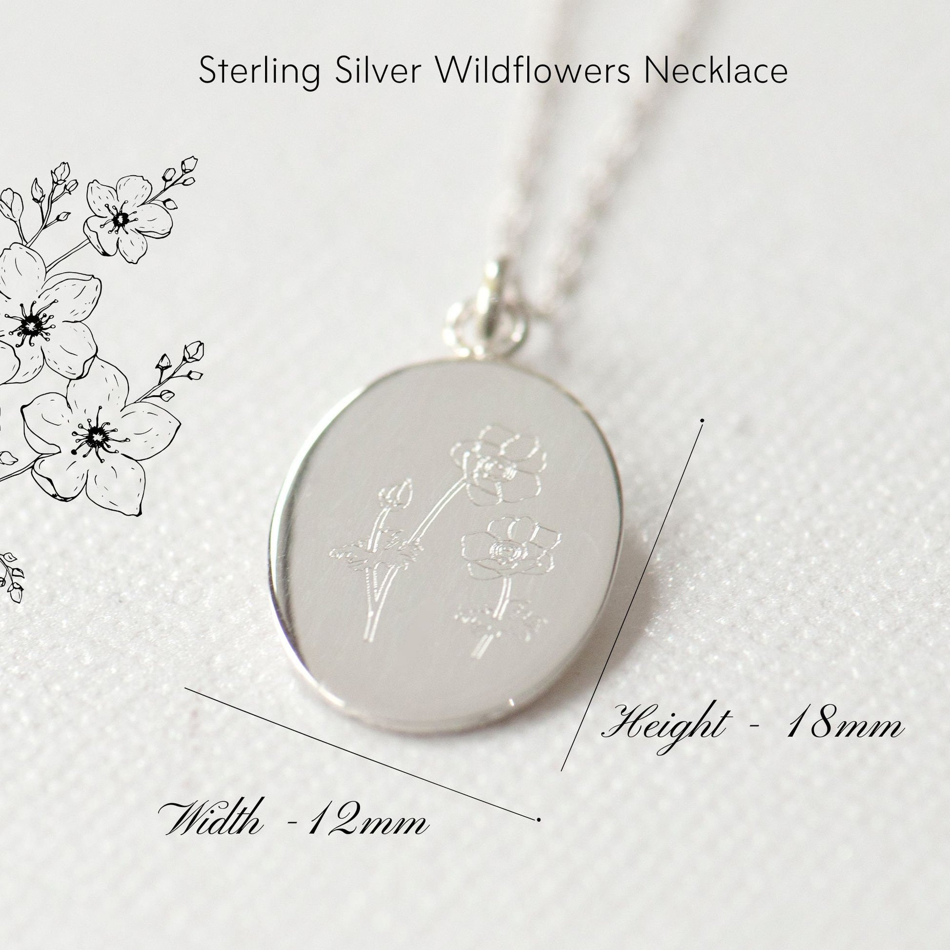 A sterling silver wildflowers necklace with an oval flower pendant, featuring line art of flowers on the pendant and a measurement diagram showing the necklace length and width.