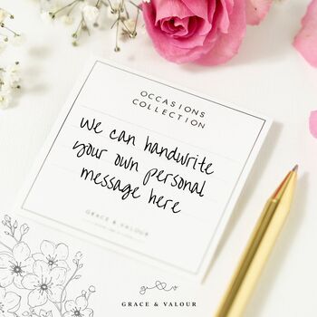 writing a gift message on the back of the gift card for the recipient